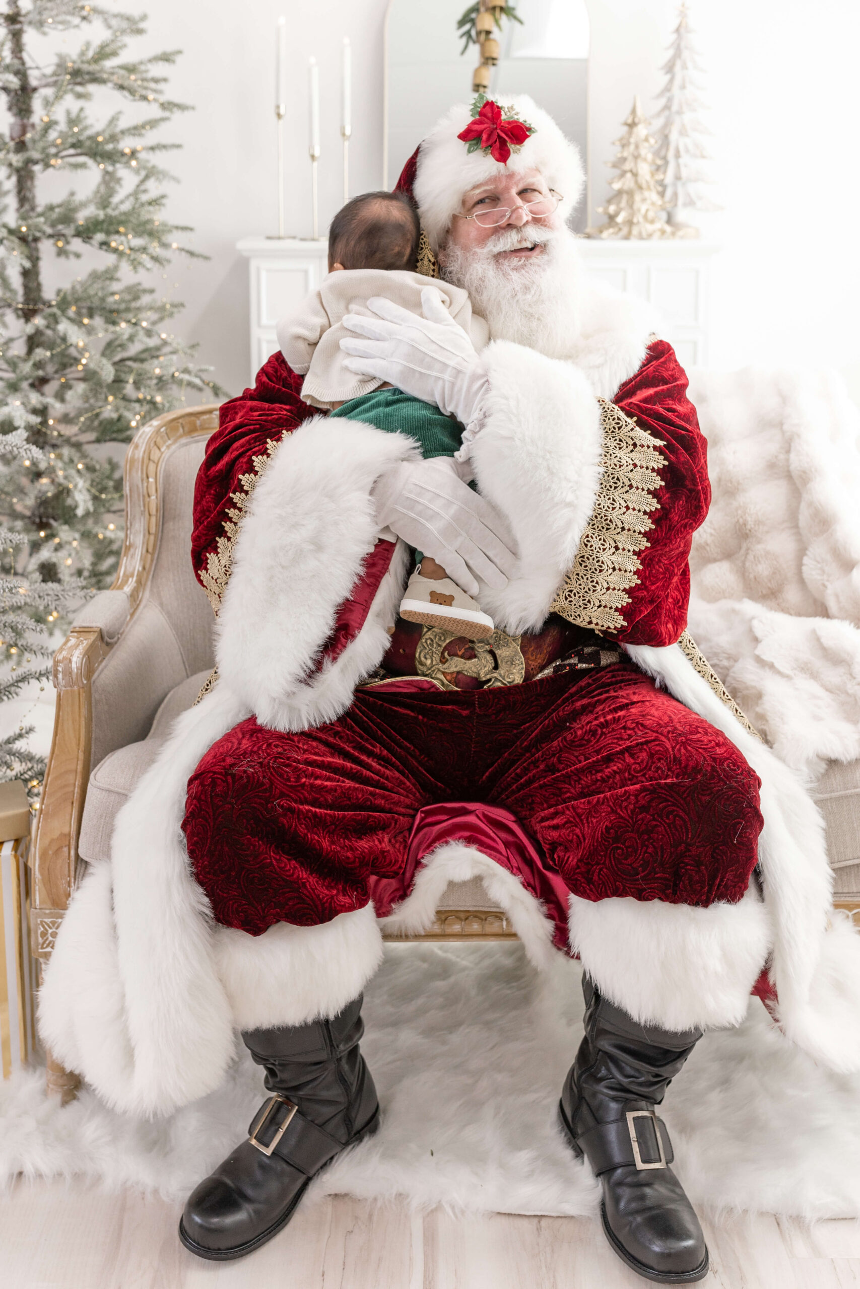 Santa hugging a newborn baby