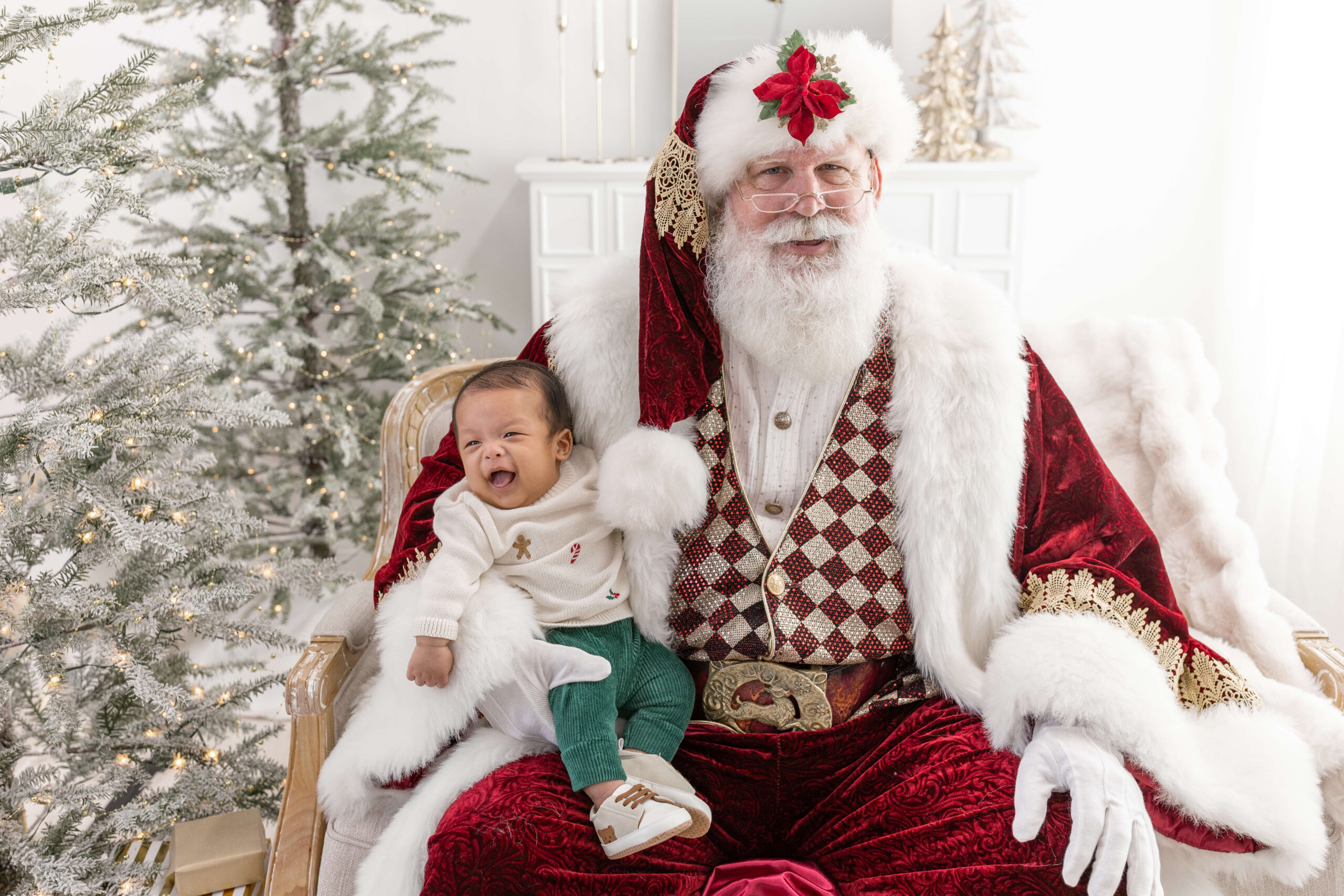 Santa holding a newborn baby