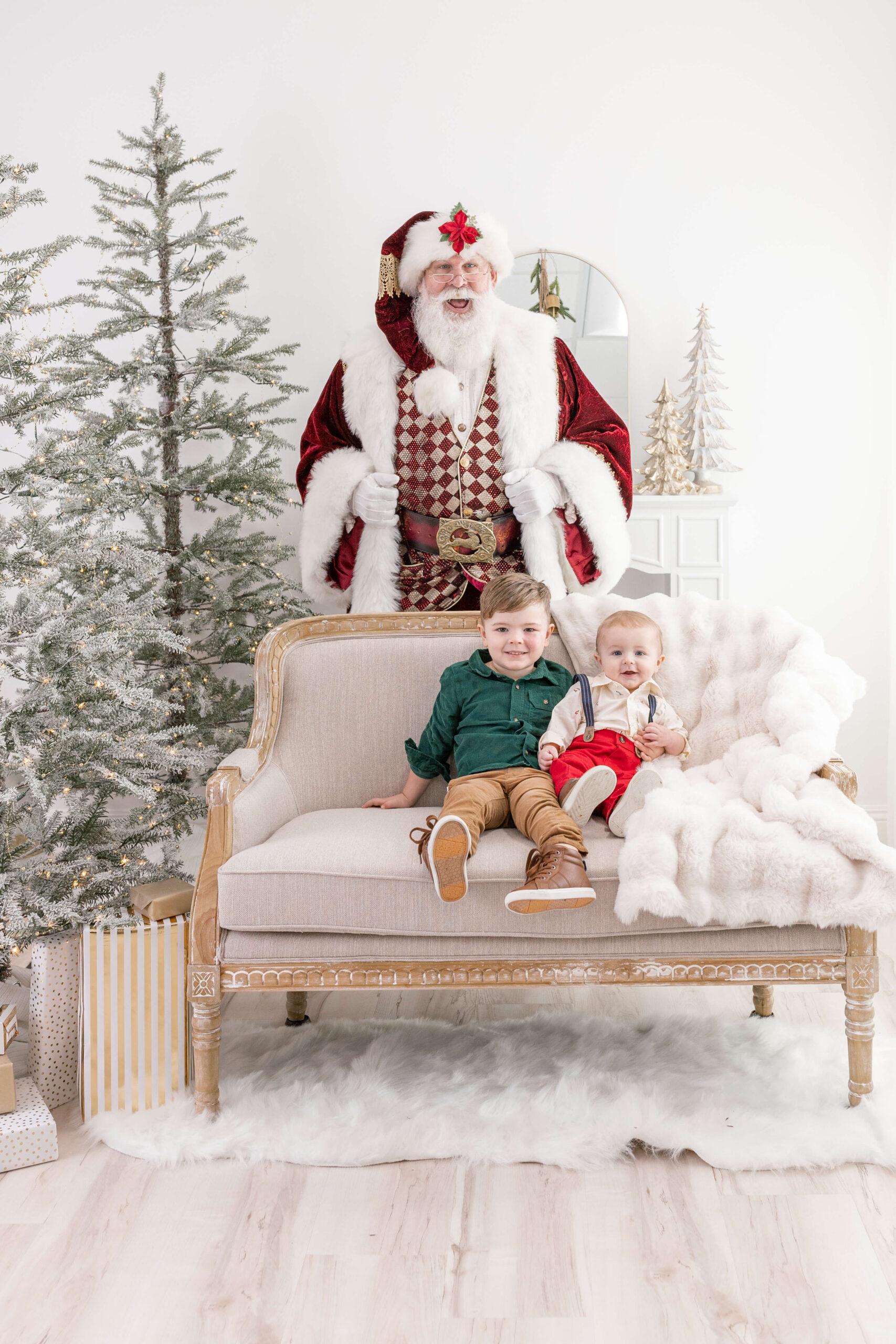 Santa with two children on sofa in OC