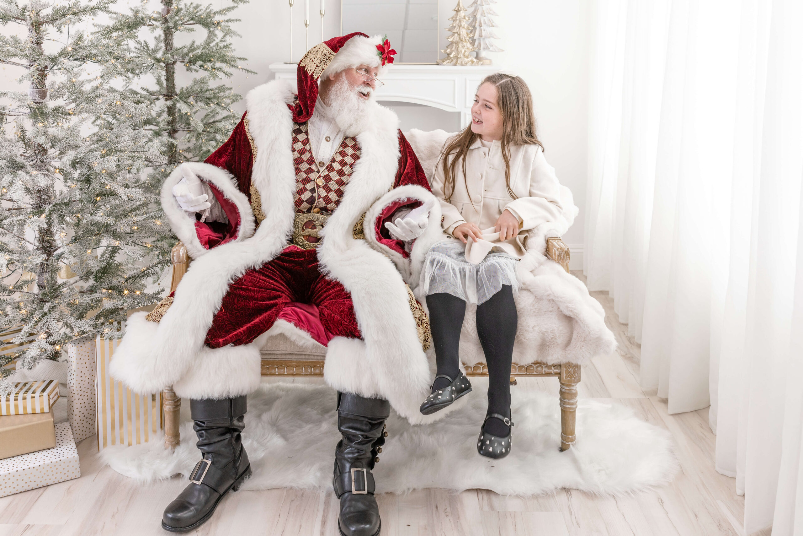 A young girl on a couch talking to Santa